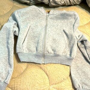 Cropped grey hoodie jacket.